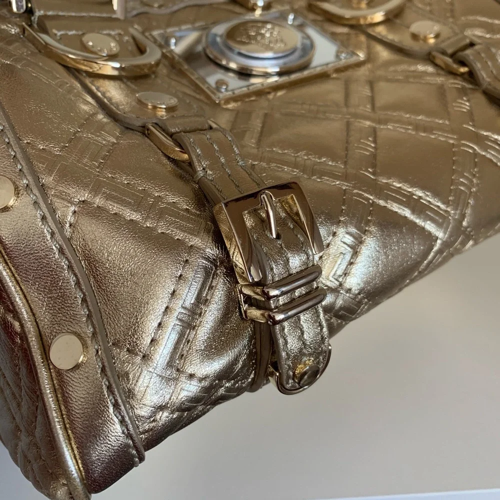 Hold Versace gold quilted handbag